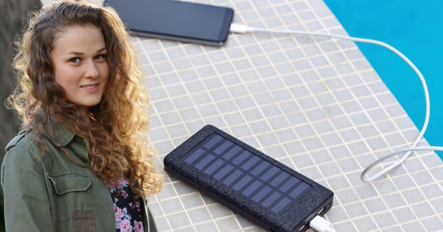 Portable solar-powered charger for cell phones and mobile devices, ideal for outdoor use and eco-friendly charging solutions.